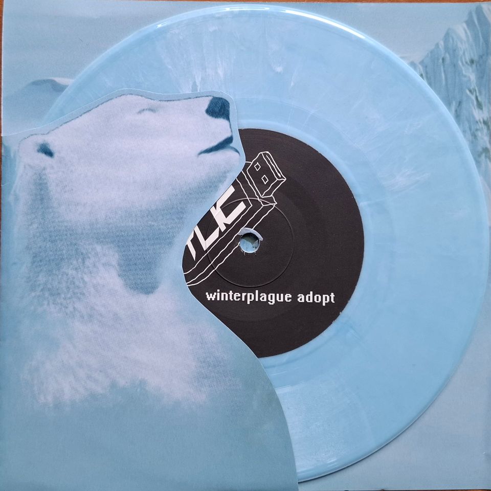 TLIC - Winterplague Adopt (Blue Marbled. Ltd. Die-Cut) Light Blue Marbled. Ltd. Edition. Die-cut cover